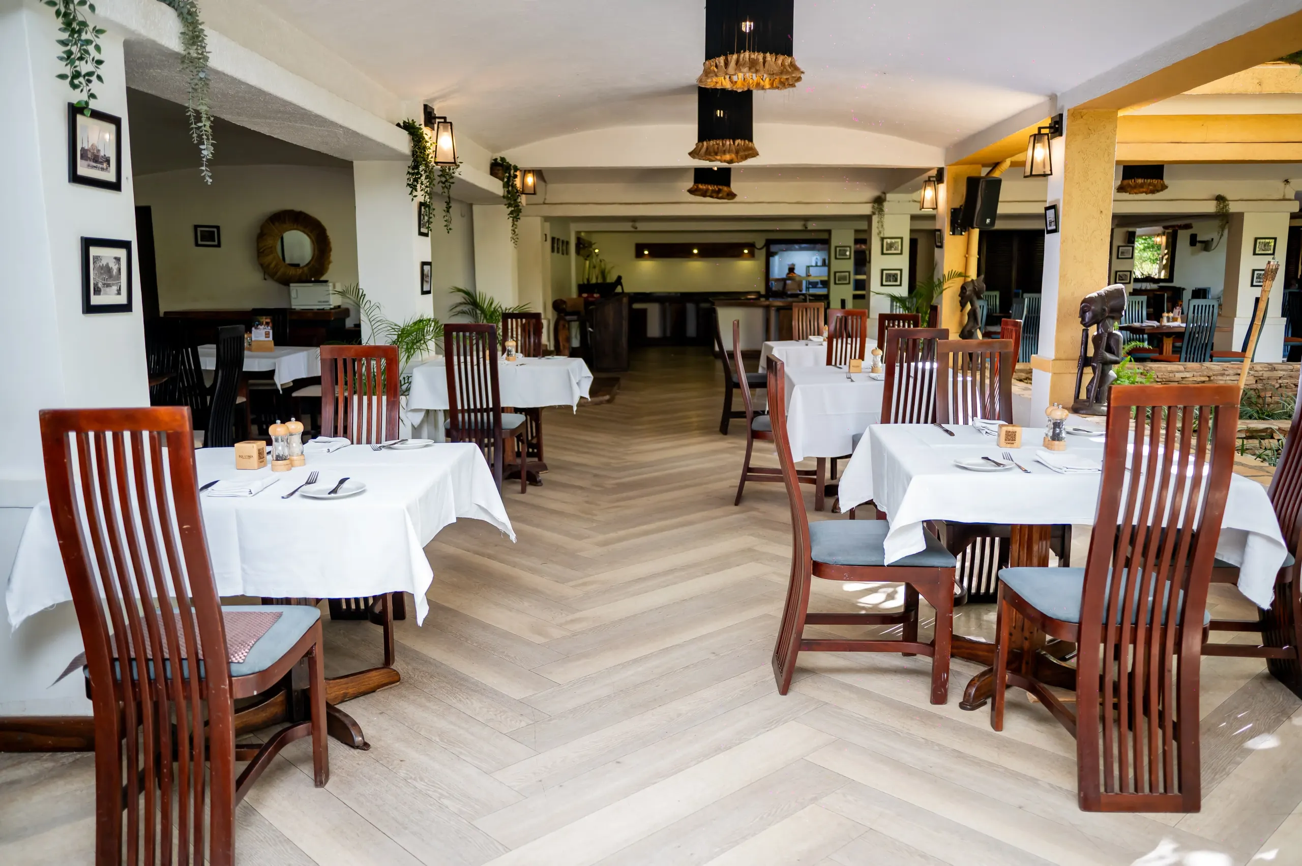 Down Equatoria's dining room to the lit kitchen counter