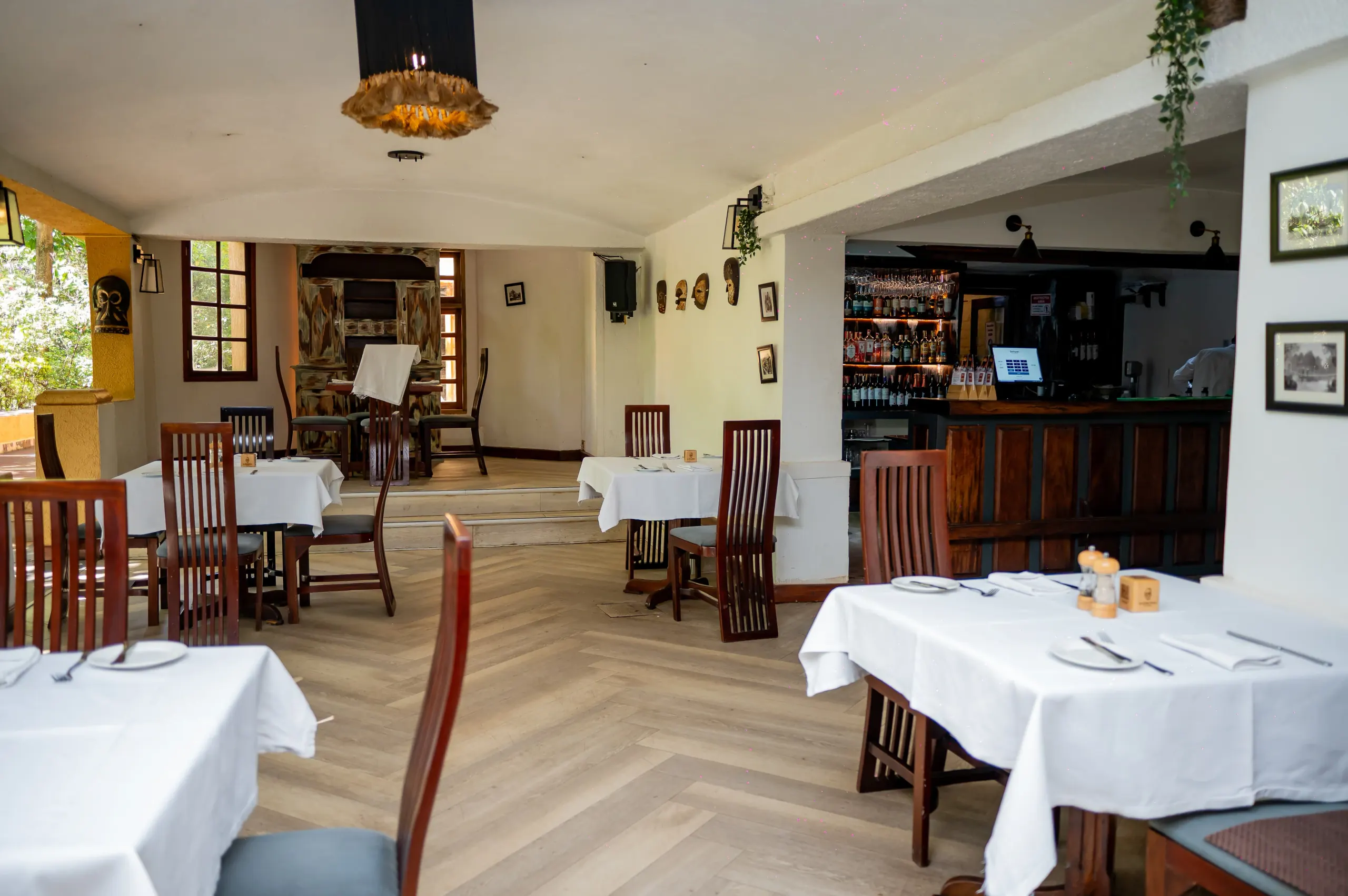 Equatoria's dining room with the bar and raised stage beyond