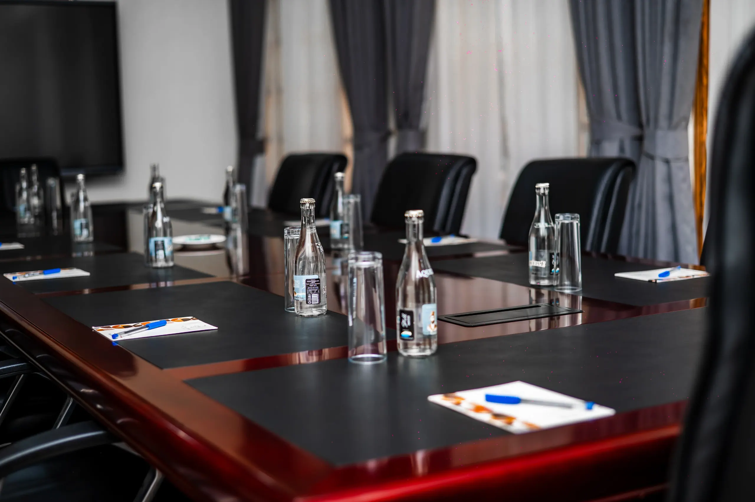 A place setting in The Boardroom with the in-table cable port