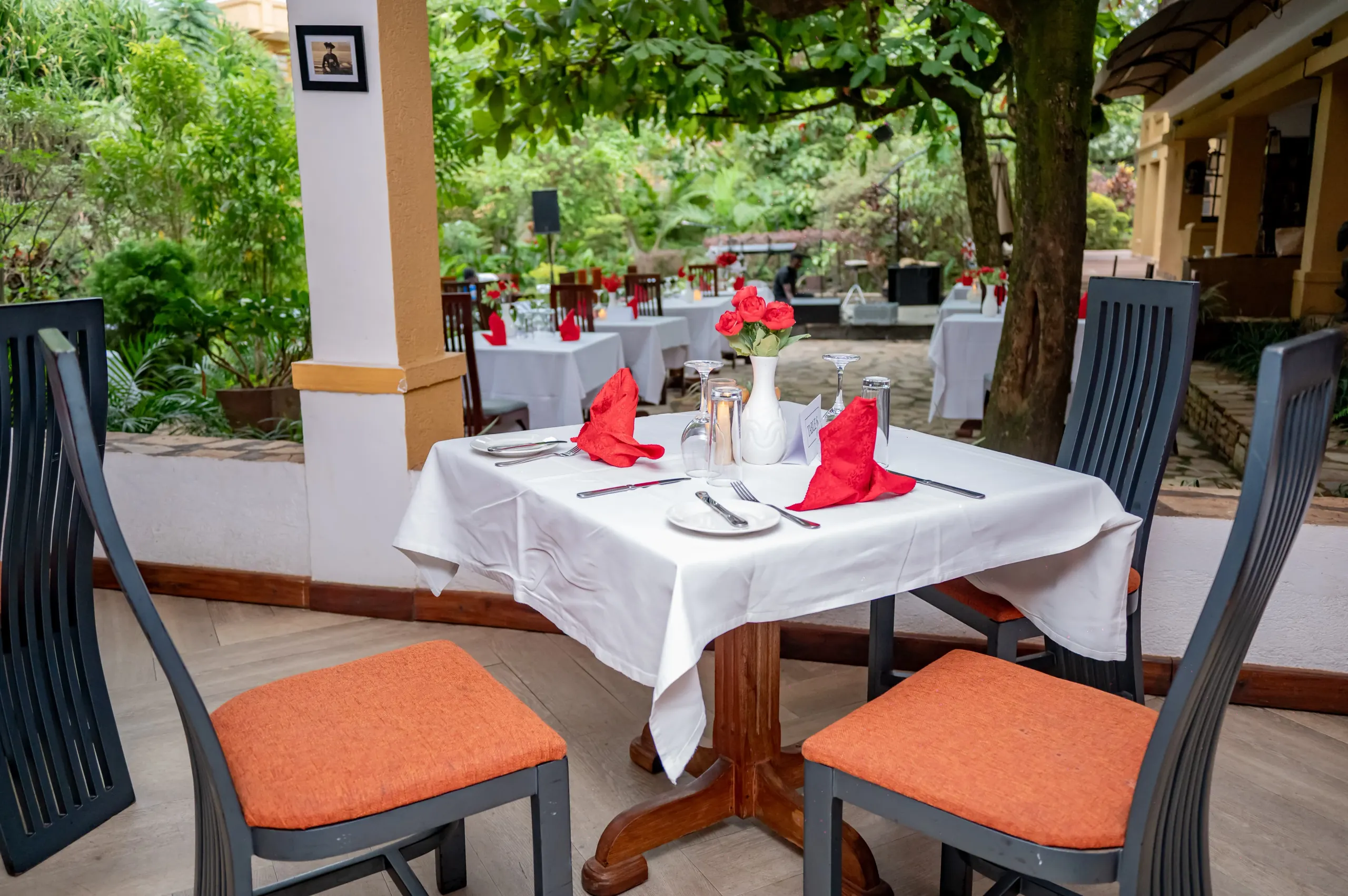 A table for two on the terrace laid with red napkins