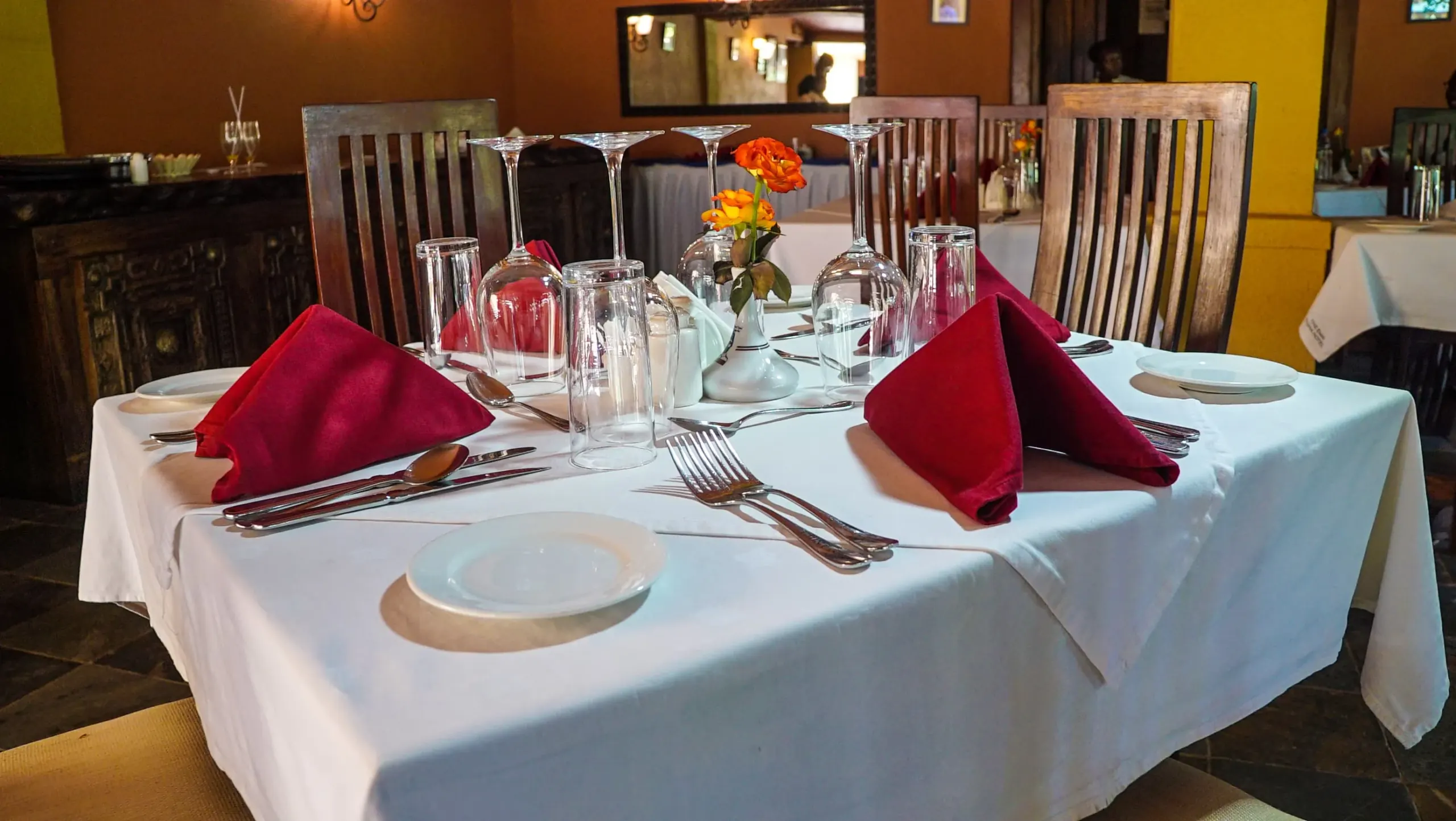 A table setting on the terrace, glassware and folded linen