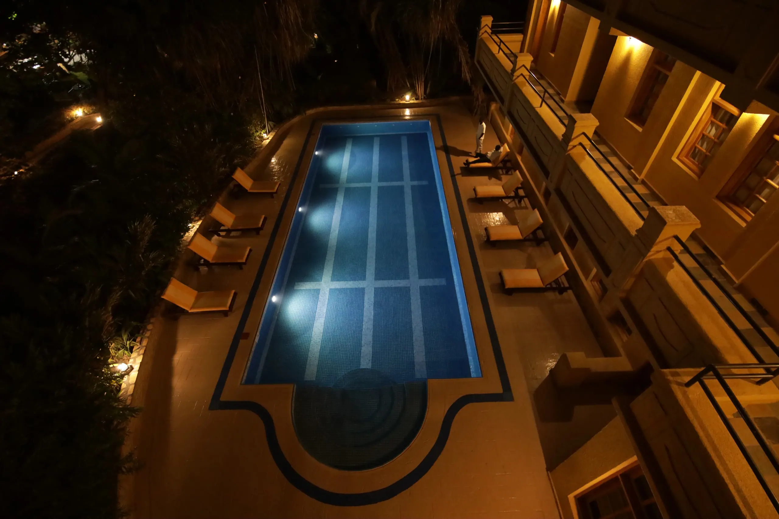 The poolside lawn set for an evening reception
