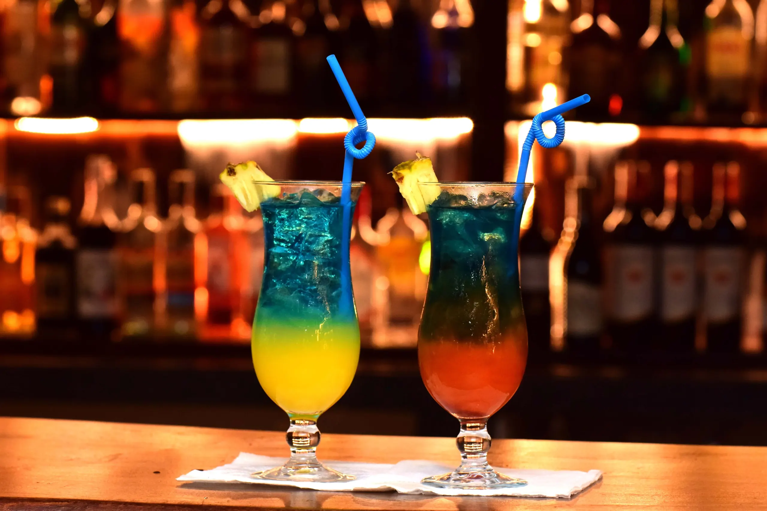 A bartender pouring a signature cocktail at Equatoria